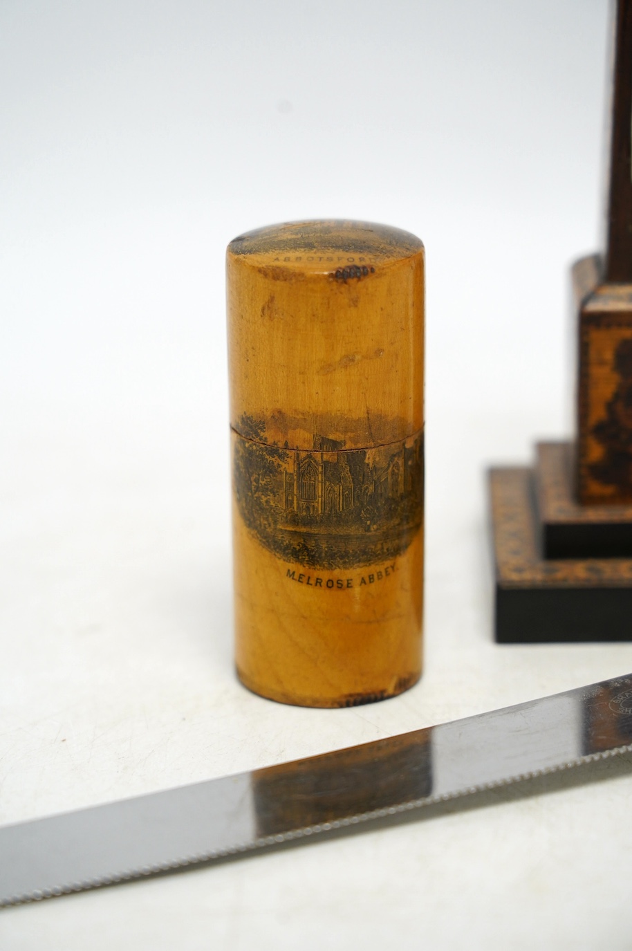 A Tunbridge ware obelisk thermometer, a Mauchline ware box and cover, and a carved bread knife, largest 32cm long. Condition - fair to good